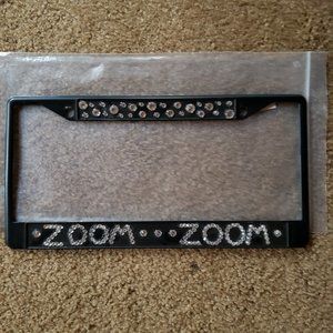 Metal license plate holder with crystals